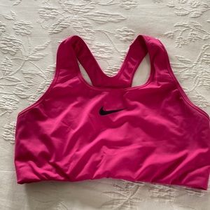 Hot pink Nike sports bra.